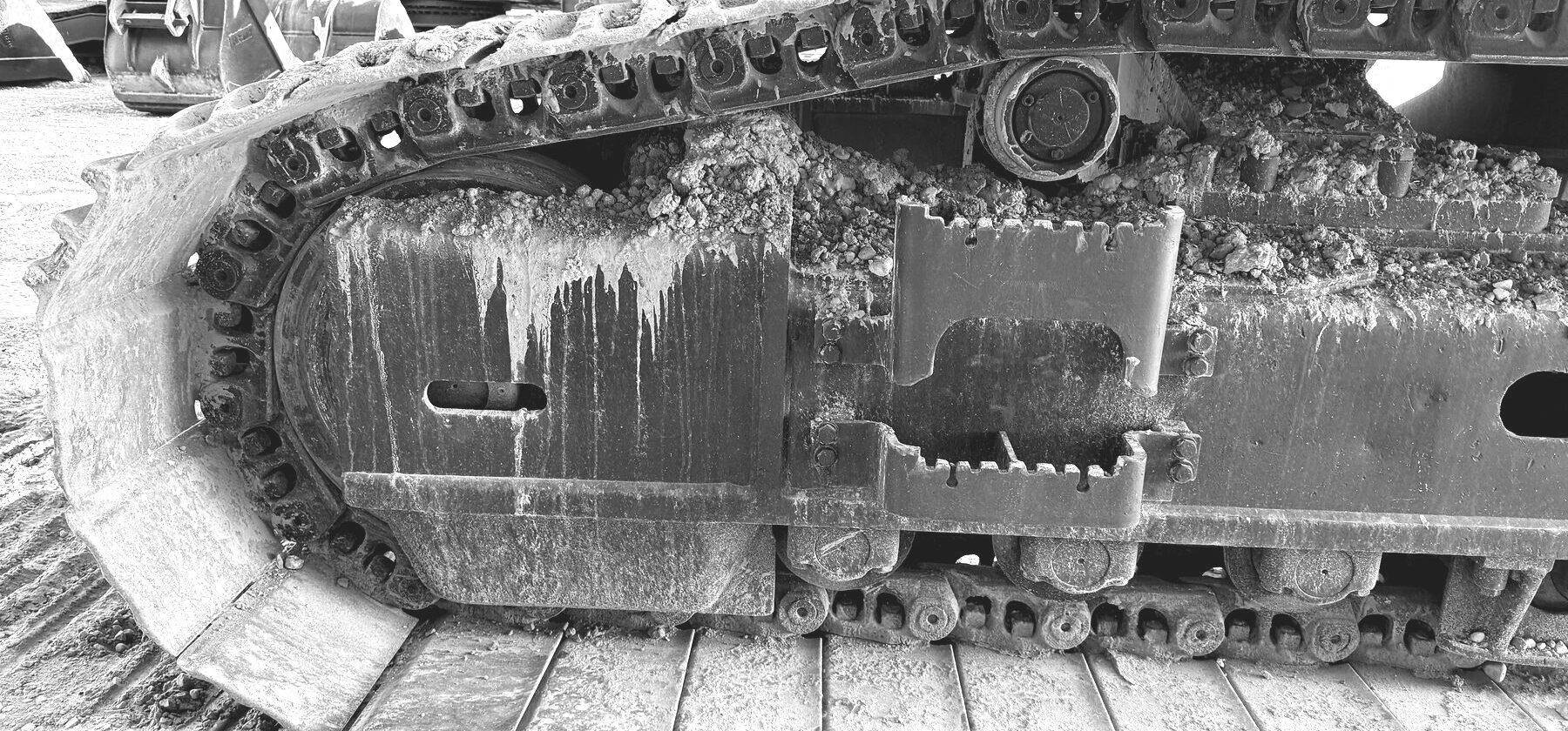 The drive sprocket and track links on a working machine